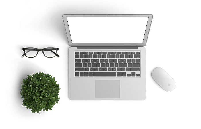 laptop with glasses, mouse and a plant